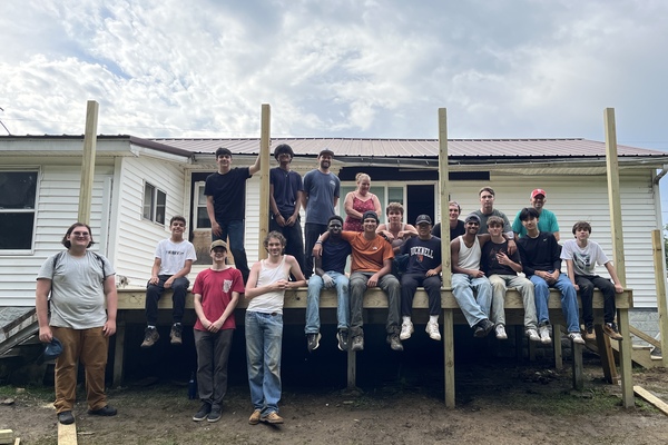 Students participating in garden service